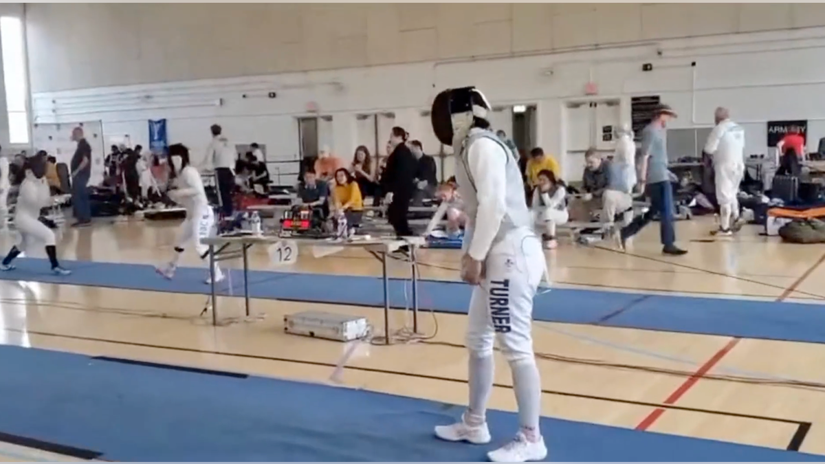 Stephanie Sullivan gets ready to kneel